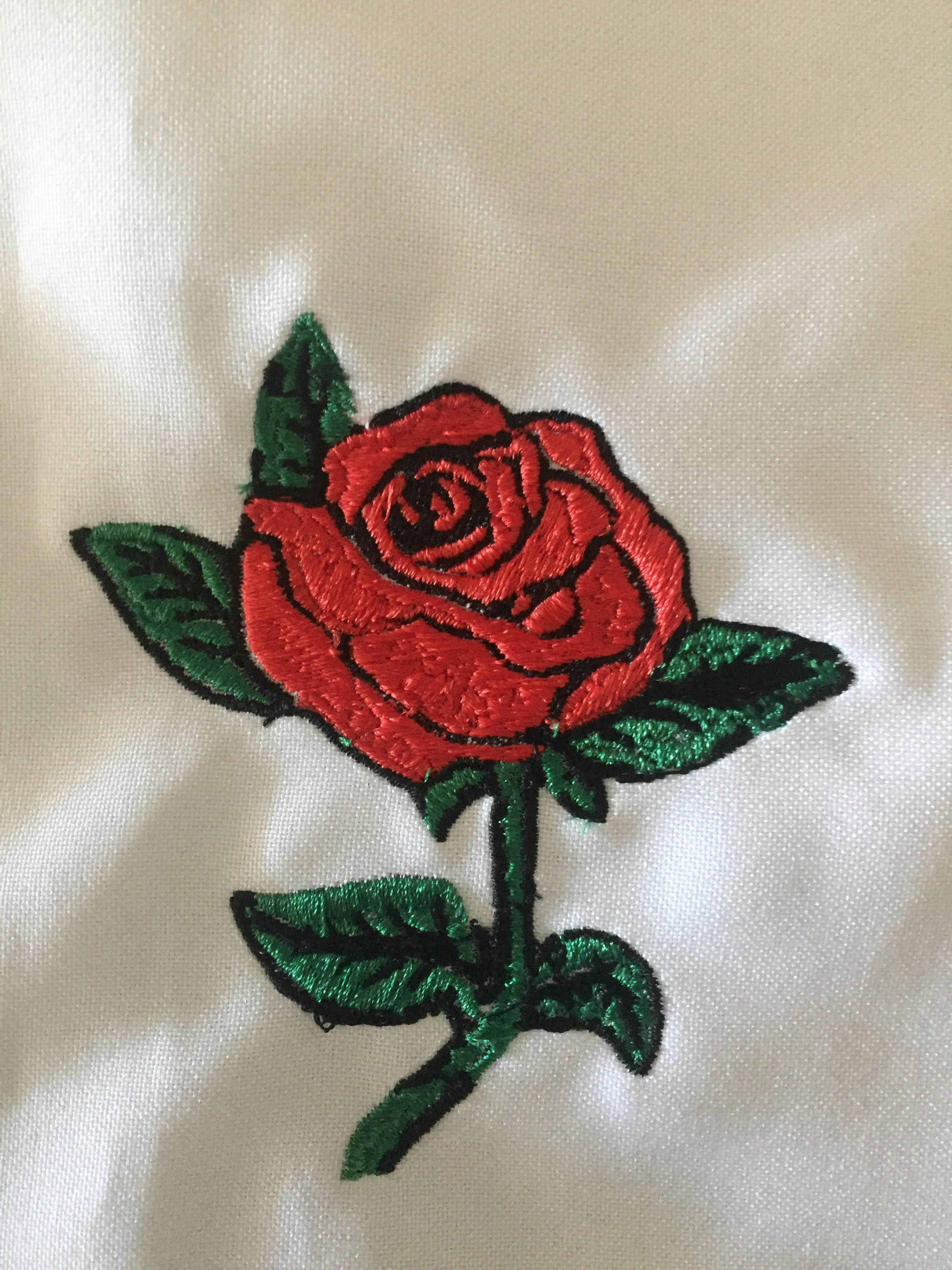 Embroidered rose stem and leaves