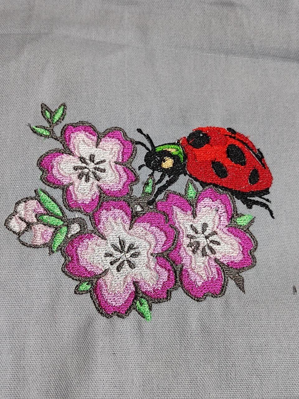 Apple flowers with ladybug free embroidery design
