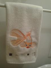Bath towel with gold fish free embroidery design
