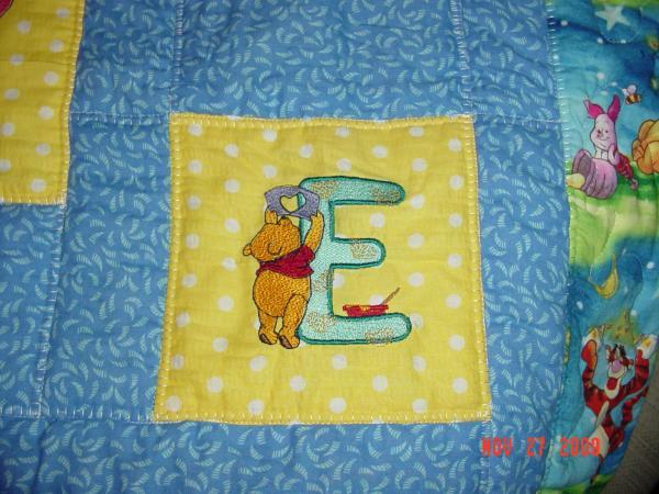 Quilt block with Winnie Pooh letter E free design for embroidery machine