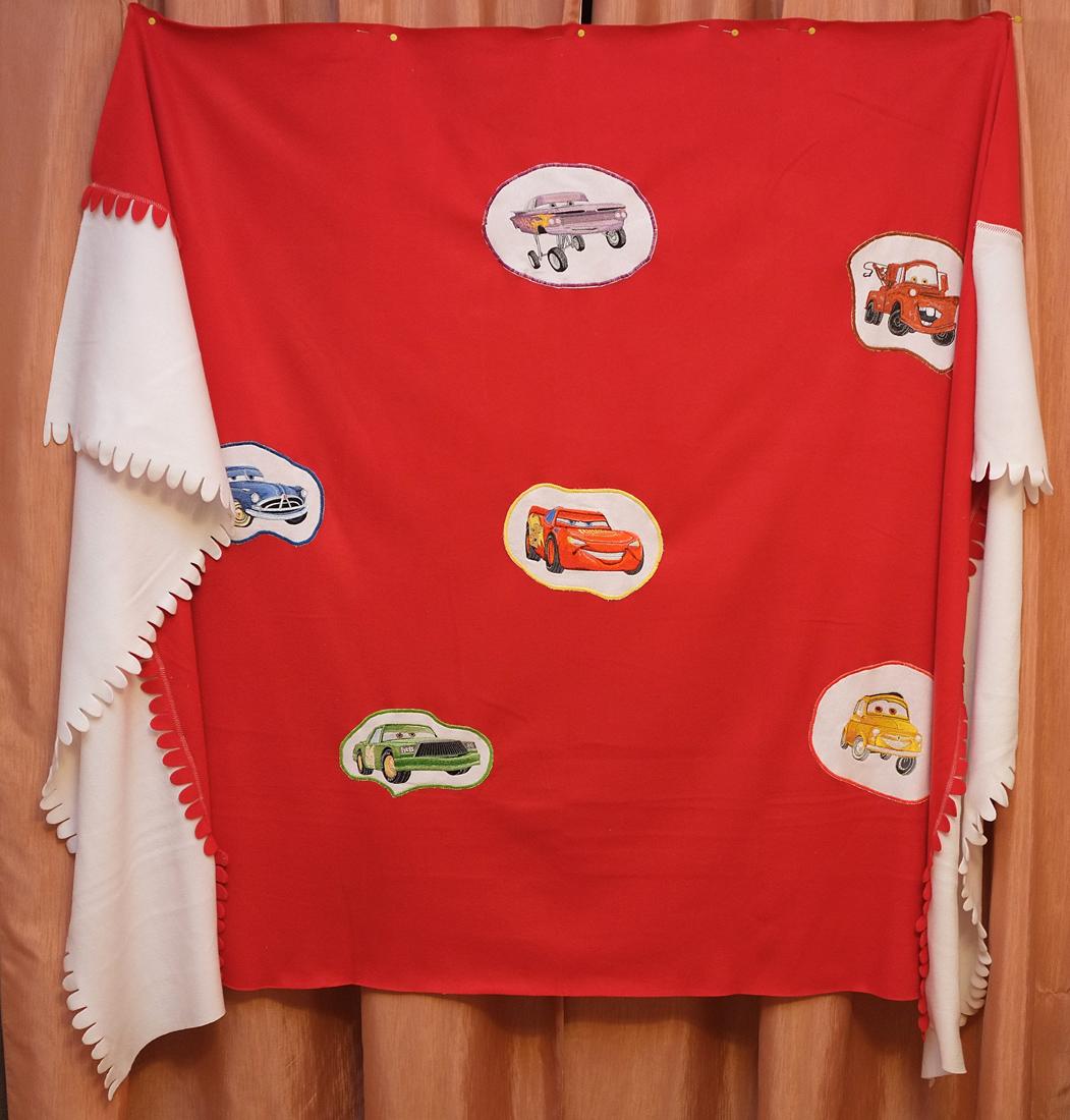 Embroidered cover with cars embroidery