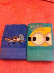 Embroidered towel with Minion and airplane design