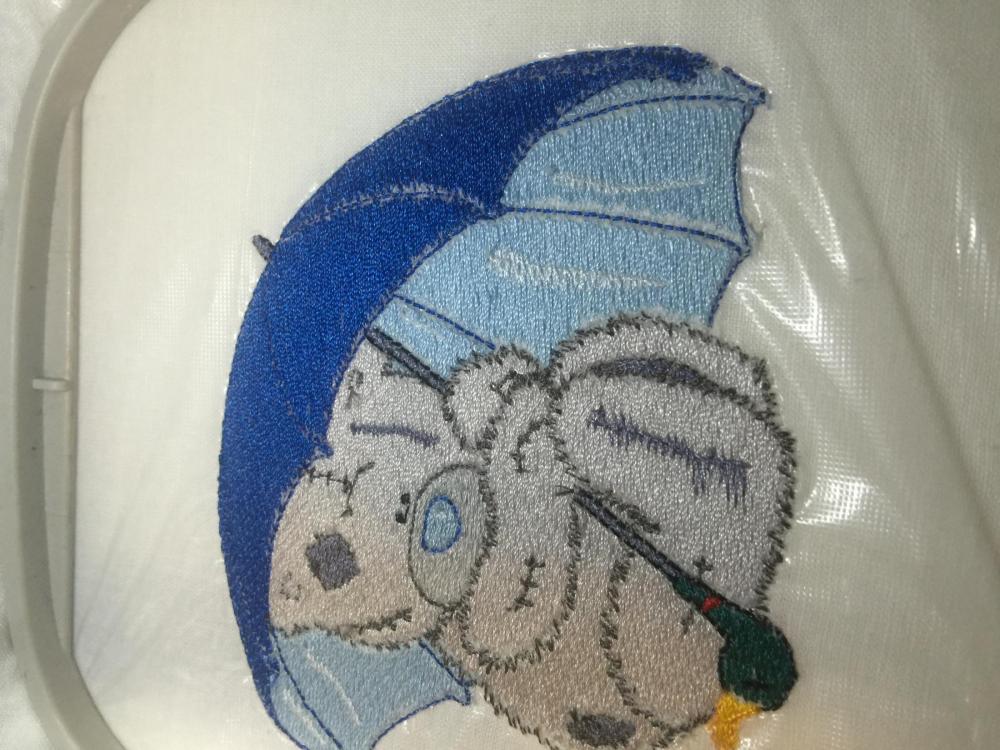 Embroidered Tatty teddy under rain embroidery design