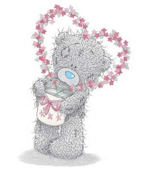 Teddy bear with flowers heart