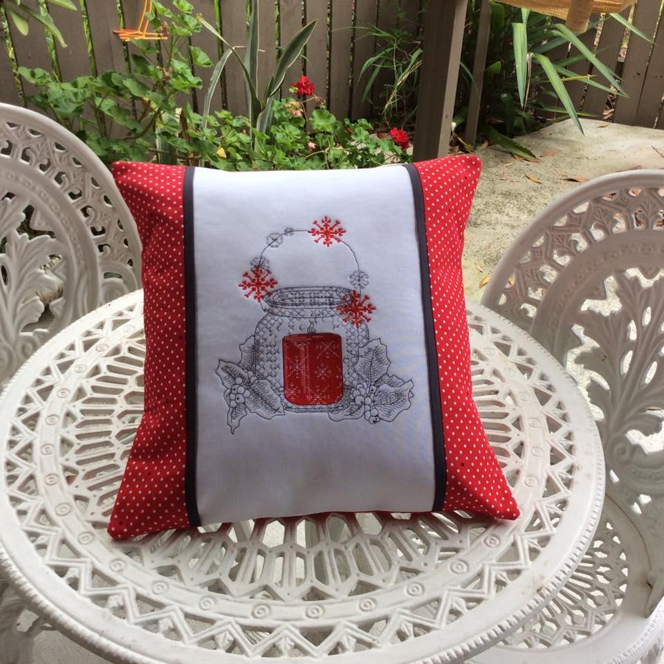 Pillow with cross stitch free embroidery design