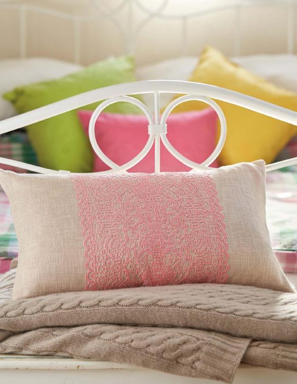 Pillow with pink embroidery design