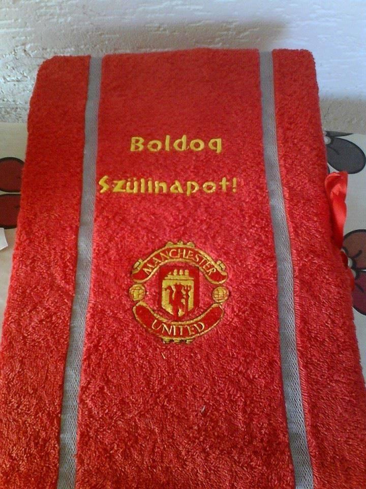 A bath towel with a Manchester United fc logo embroidery design