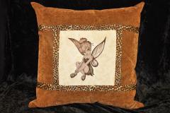 A pillow with Tinker Bell sitting embroidery design