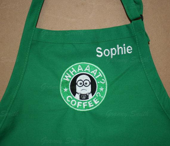 A green apron with a Starbucks minion and an inscription embroidery design