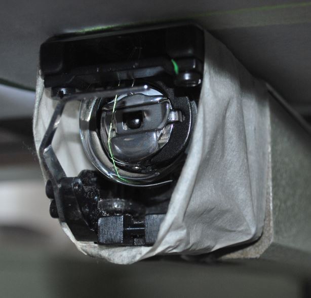 Embroidered designs process on winter sportwear Embroidery design finals stage