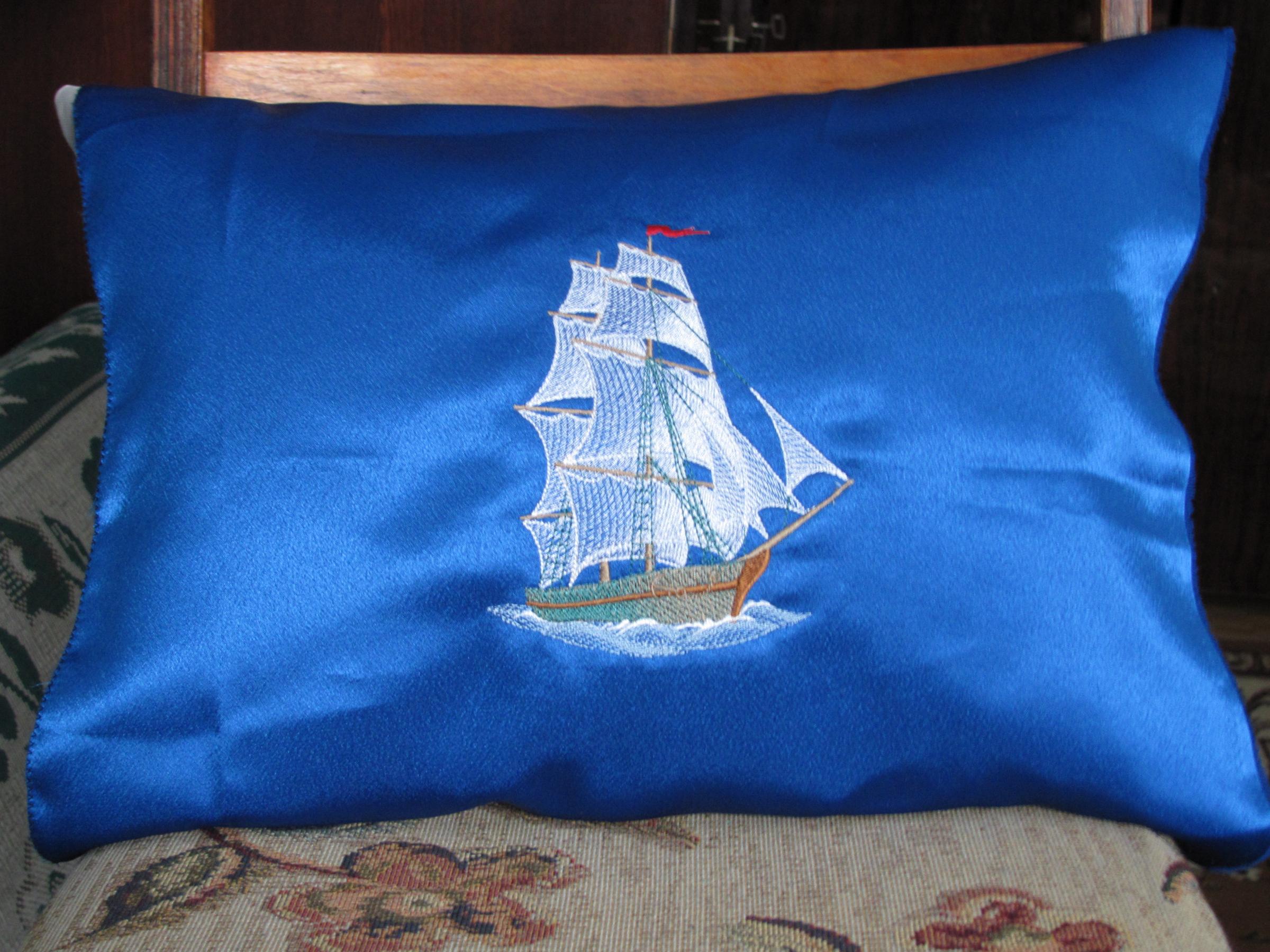 Blue pillow with Sea ship free embroidery design