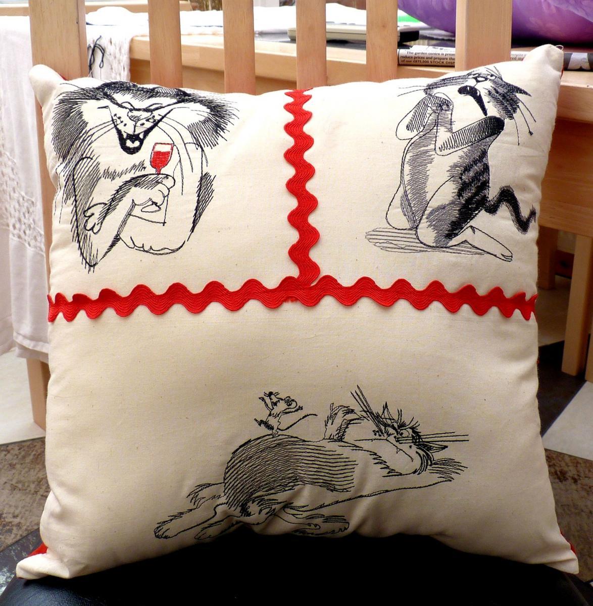 Pillow with crazy cats free embroidery design