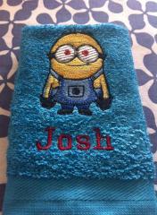 Blue towel with Minion embroidery design