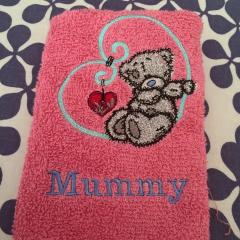 Towel with loving Teddy Bear embroidery design