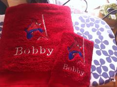 Two red bath towels with Spiderman embroidery design