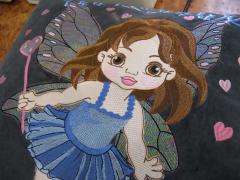Sofa cushion with Baby love fairy embroidery design