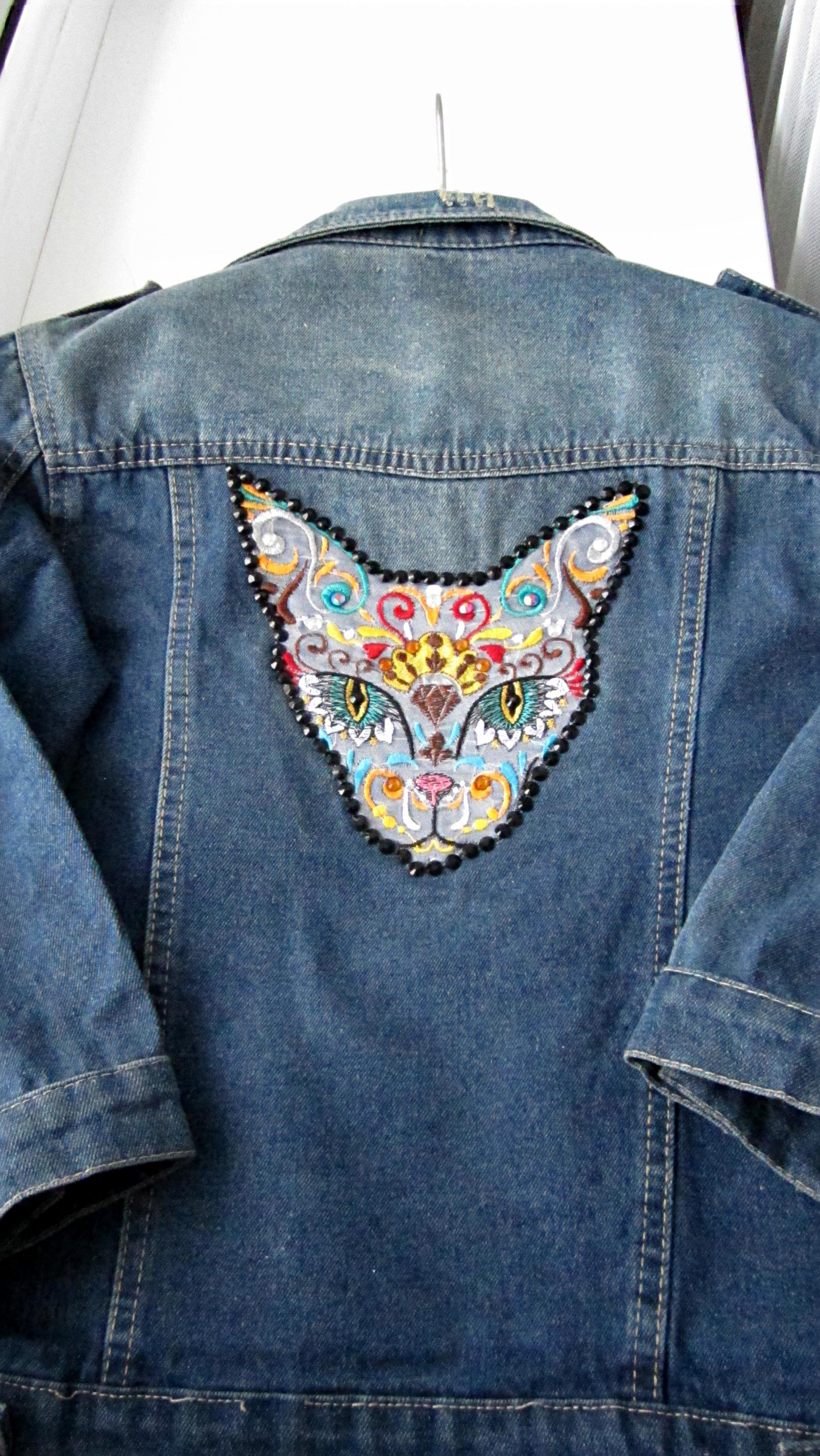 Denim jacket with Mexican cat embroidery design