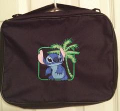 Travel bag with stitch free embroidery design