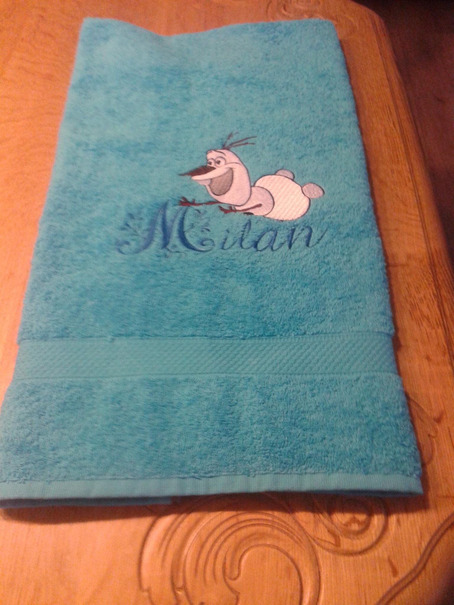 Bath towel with Olaf flying embroidery design