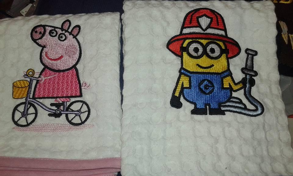 Towels with cartoon characters embroidery design