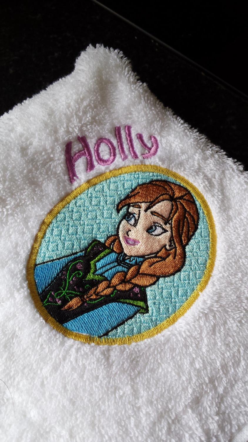 Towel with Anna badge embroidery design