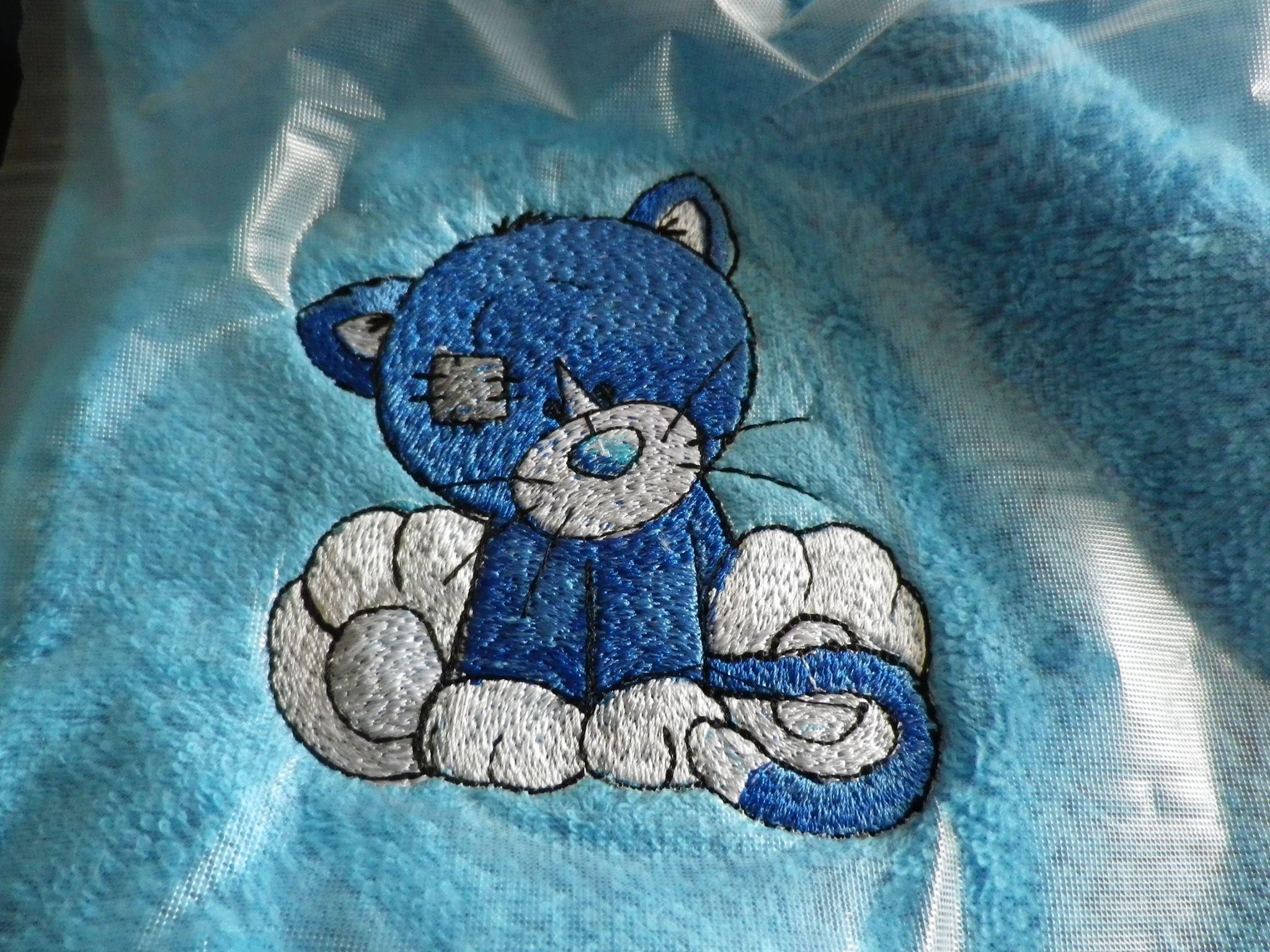 Bath towel with Kitty Wink embroidery design