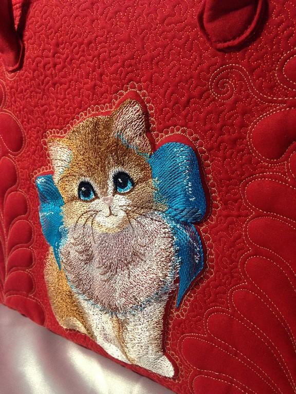 Kitten with bow machine embroidery design at bag