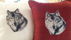 Embroidered pillows with wolf photo stitch design