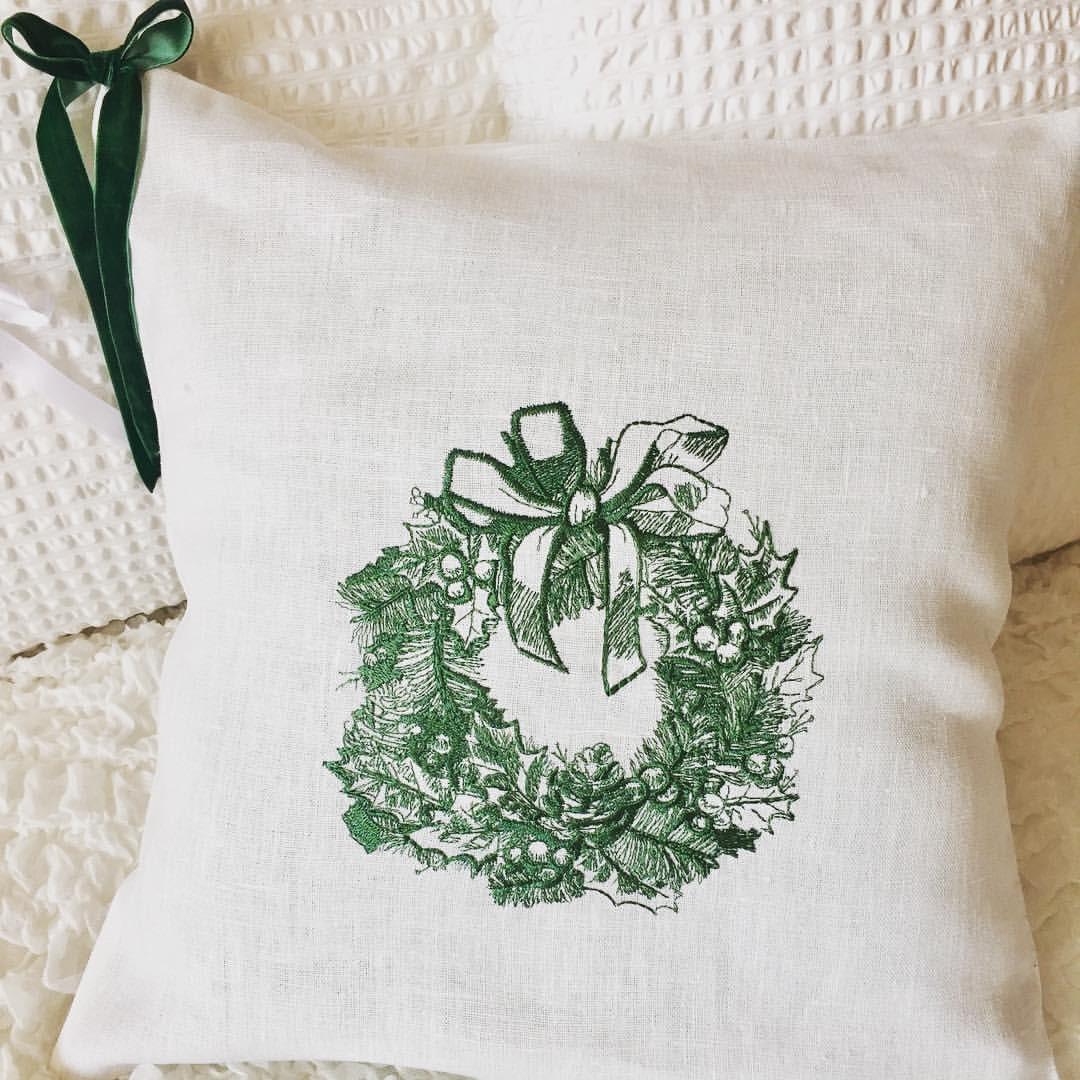 Sofa cushion with Christmas wreath embroidery design