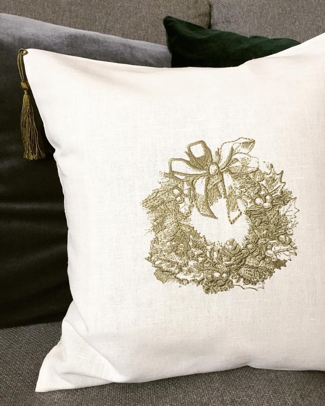 Cushion with Christmas wreath embroidery design