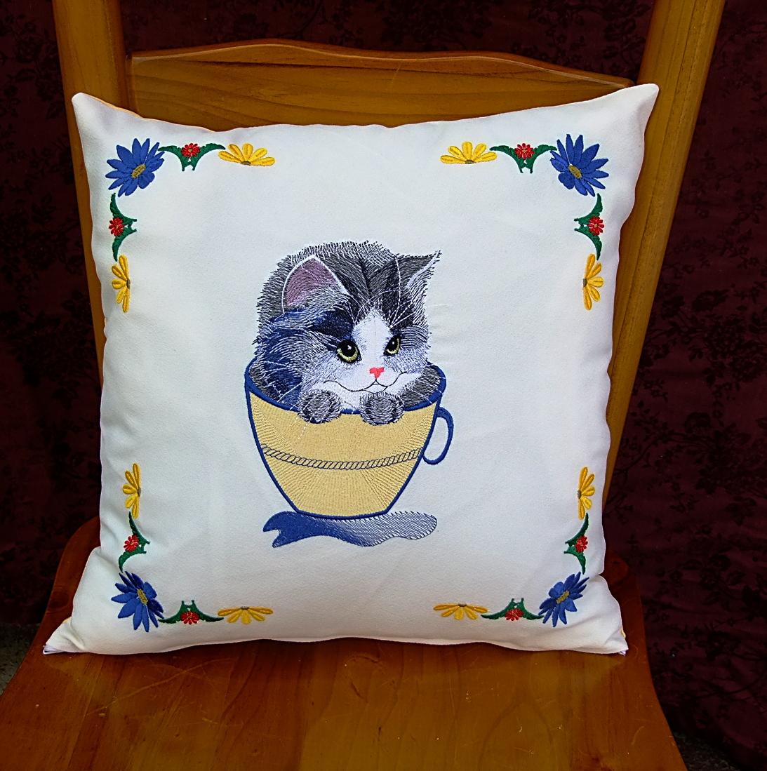 Embroidered cushion with cat mug design