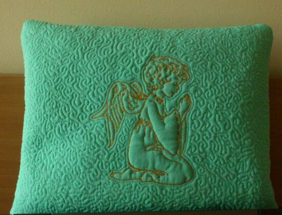 Sofa cushion with Little Angel machine embroidery design