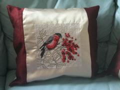 Embroidered cushion with bullfinch cross stitch design