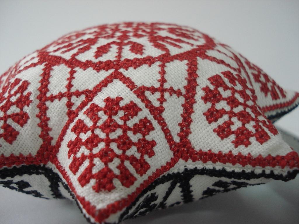 Small sewing pillow with red star cross stitch embroidery design
