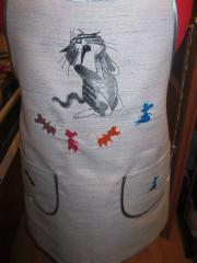 Kitchen apron with Sneaky cat free machine embroidery design