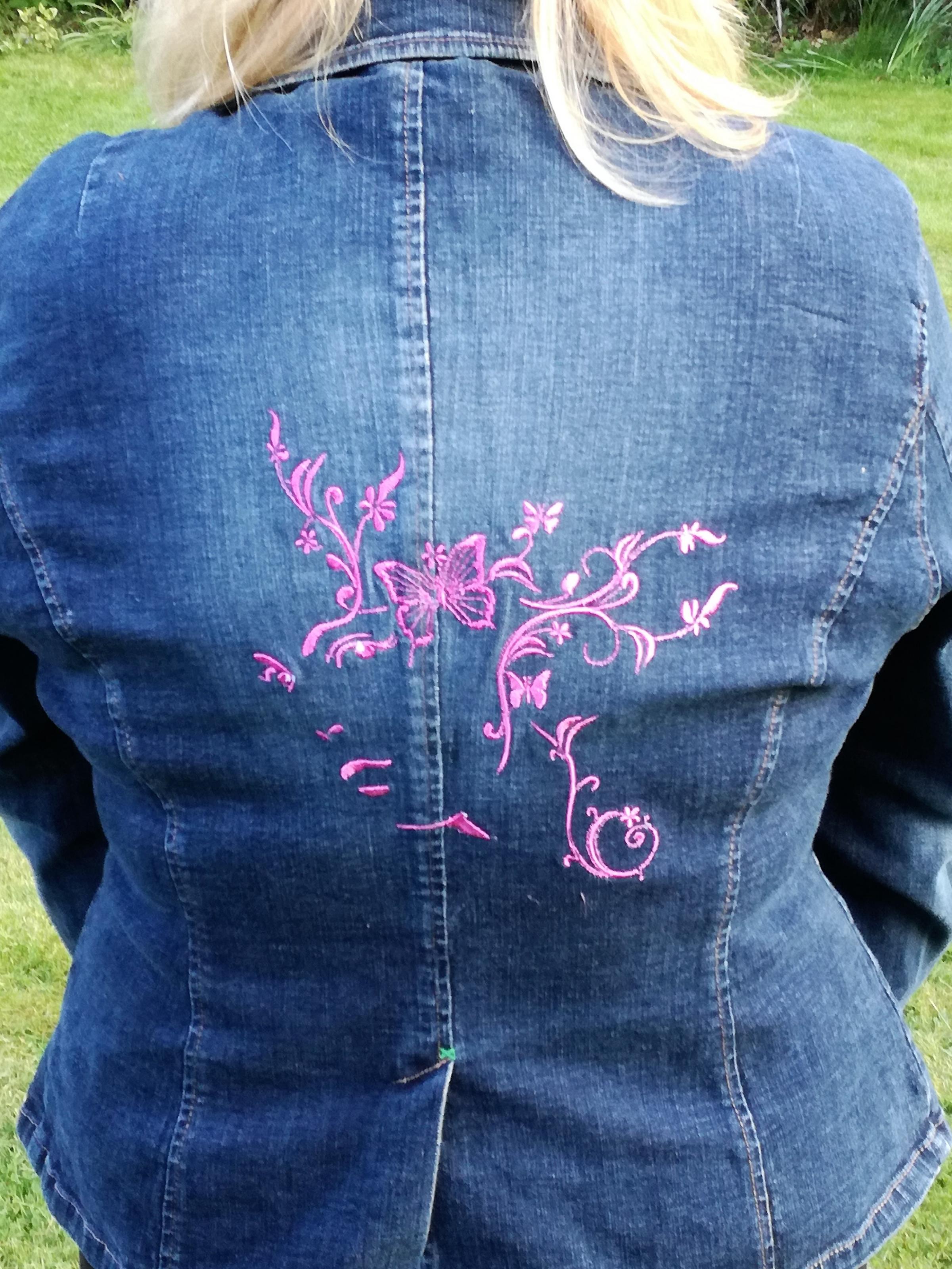 Woman and Butterfly free embroidery design on denim Jacket