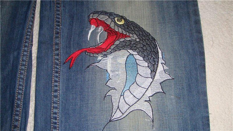 Denim fabric piece with Snakes bite embroidery design