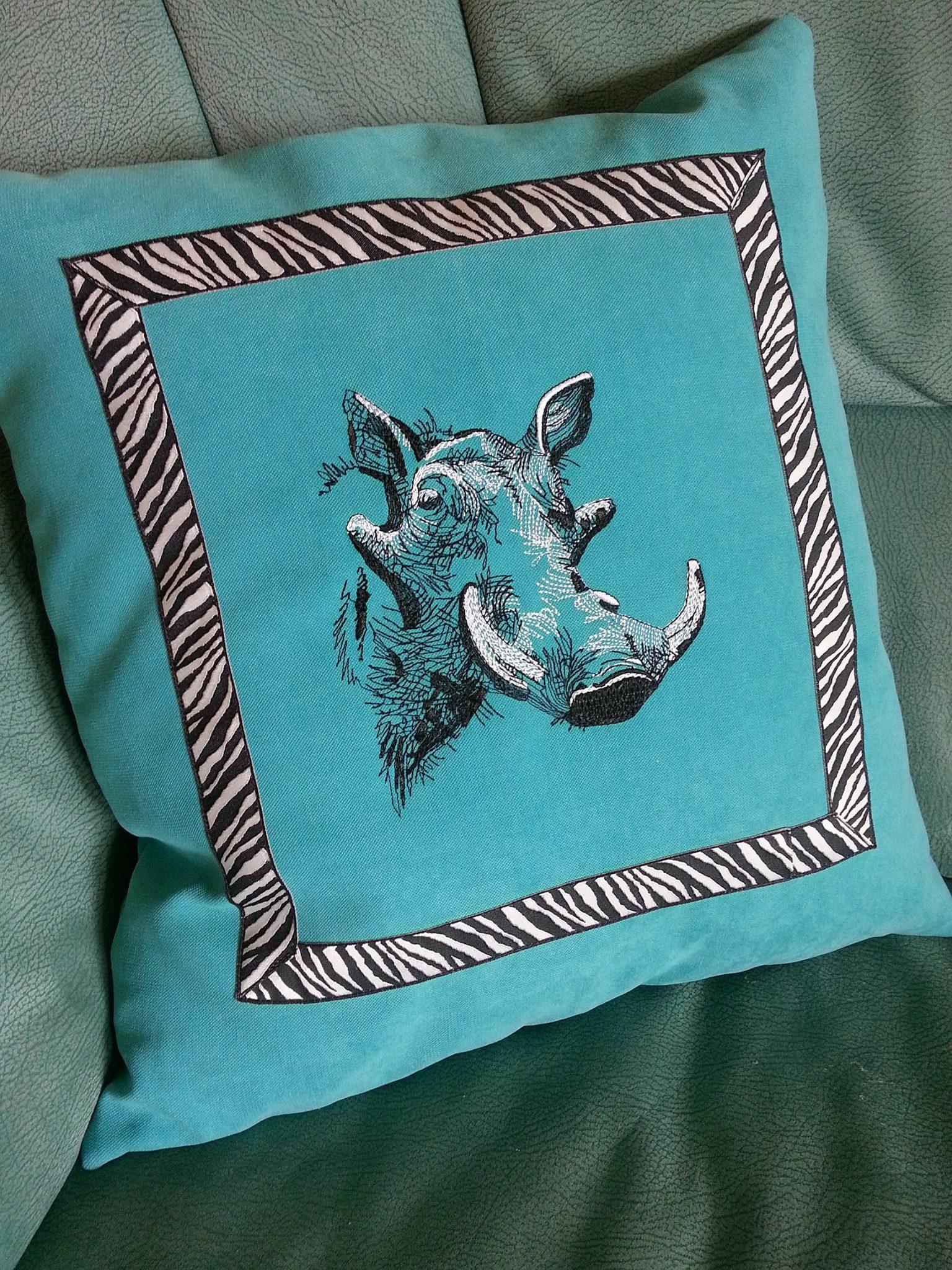 Cushion with rhino embroidery design