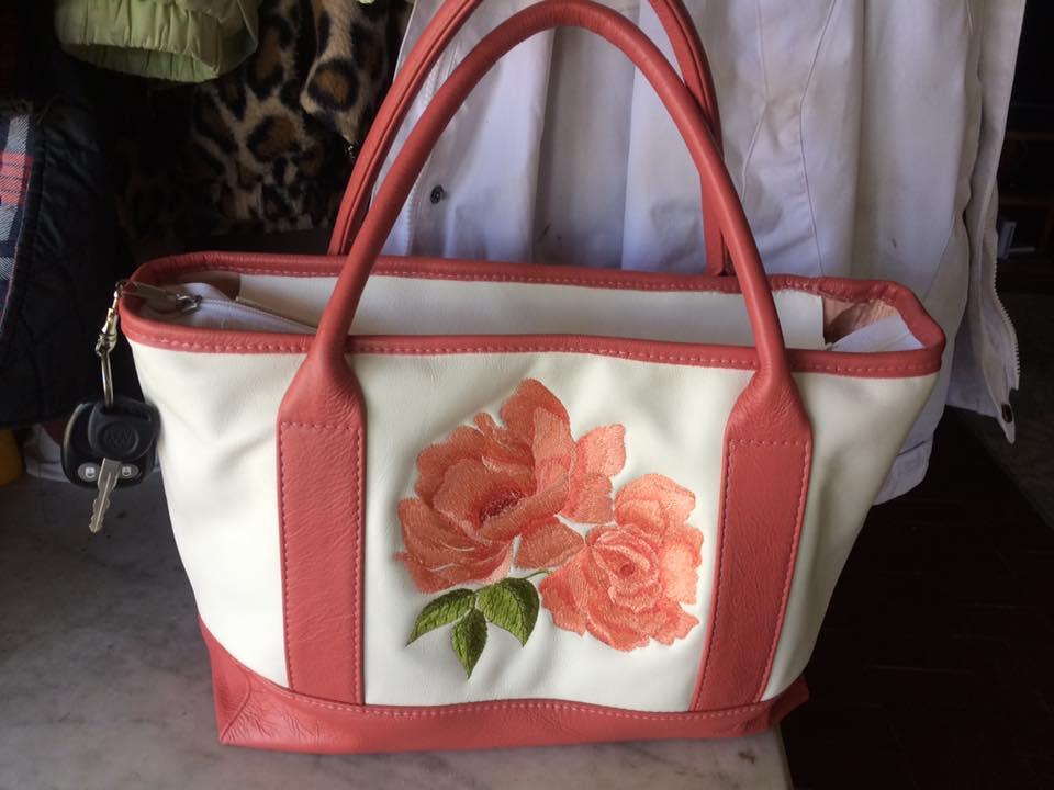 Leather bag with red rose free machine embroidery design
