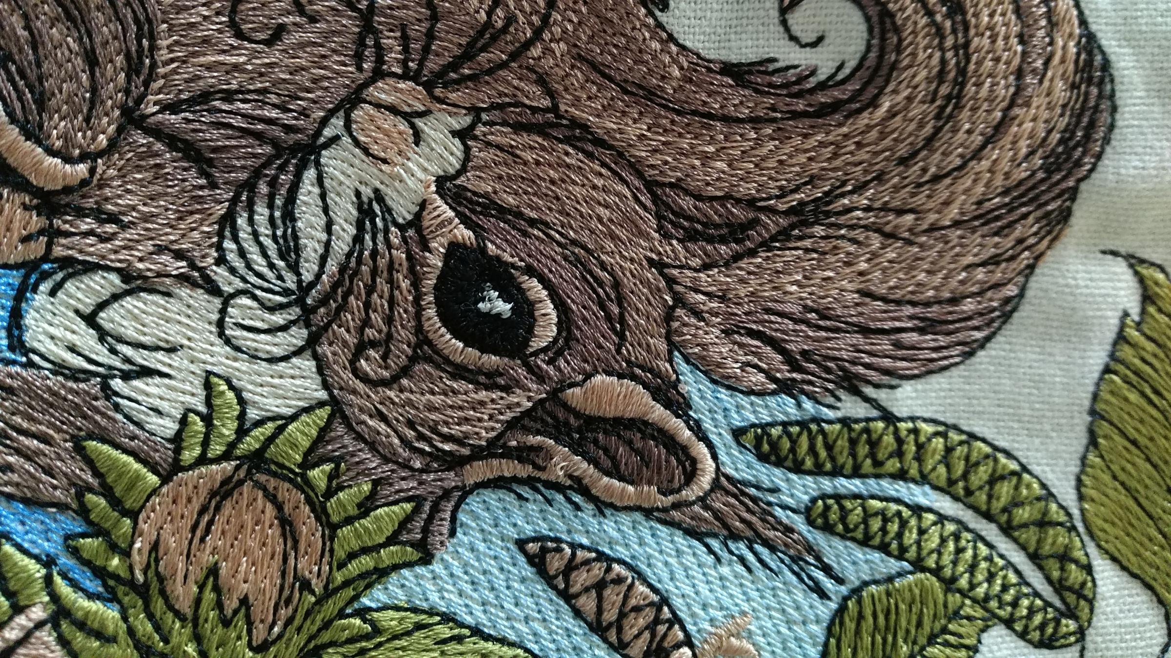 Squirrel machine embroidery design at kitchen napkin