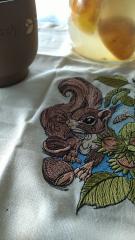 Squirrel with hazelnut embroidery napkin