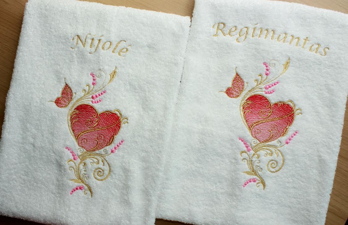 Couple of embroidered towels with gold heart and butterfly design