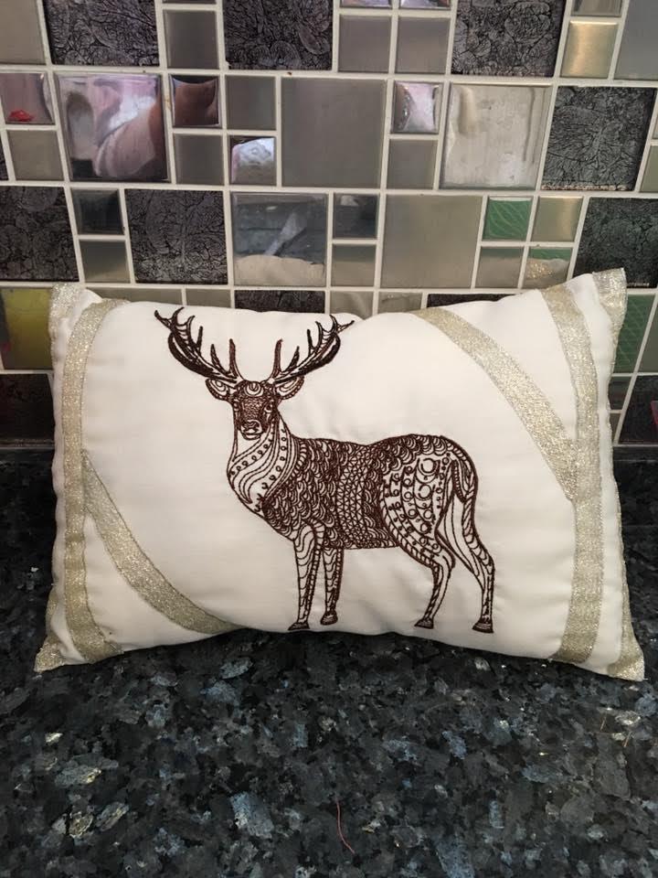 Cushion with mosaic deer embroidery design