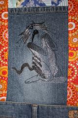 Denim with Sneaky cat free machine embroidery design