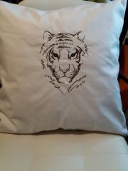 Embroidered cushion with tiger face design