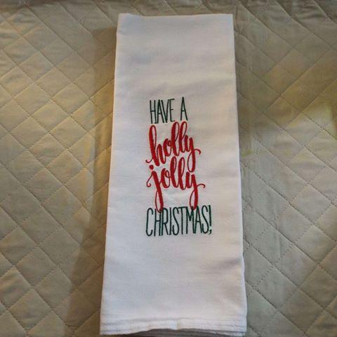 Towel with embroidered phrase Have a Holly Jolly Christmas machine embroidery design