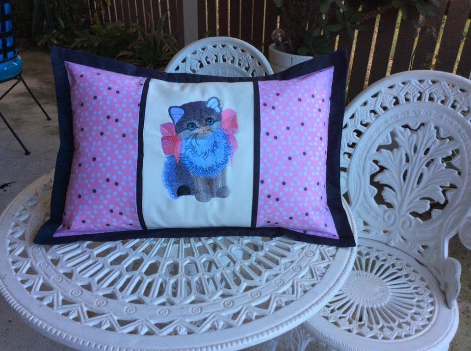Cushion with kitty with bow embroidery design
