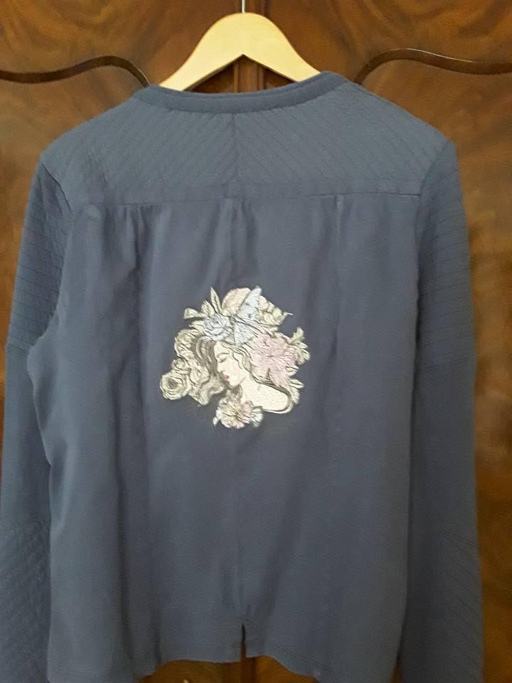 Embroidered jacket with sleeping girl design