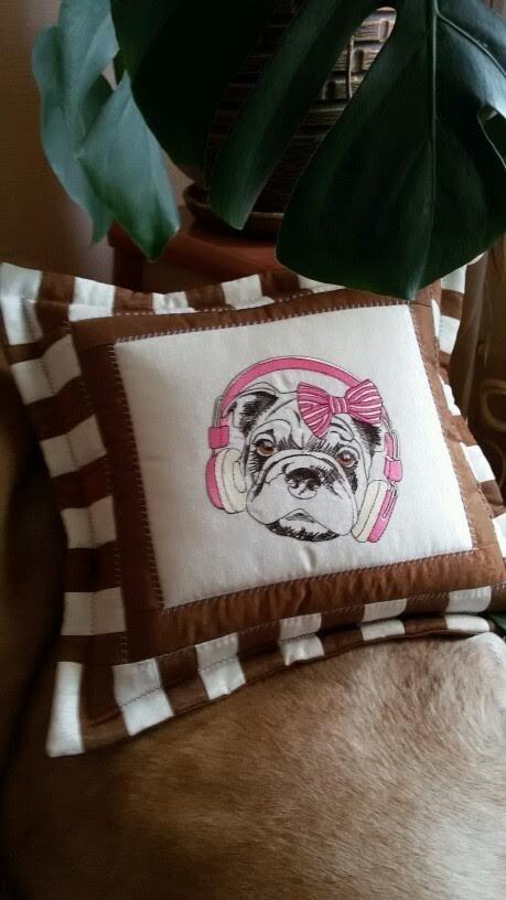 Embroidered pillow with dog in headphones design