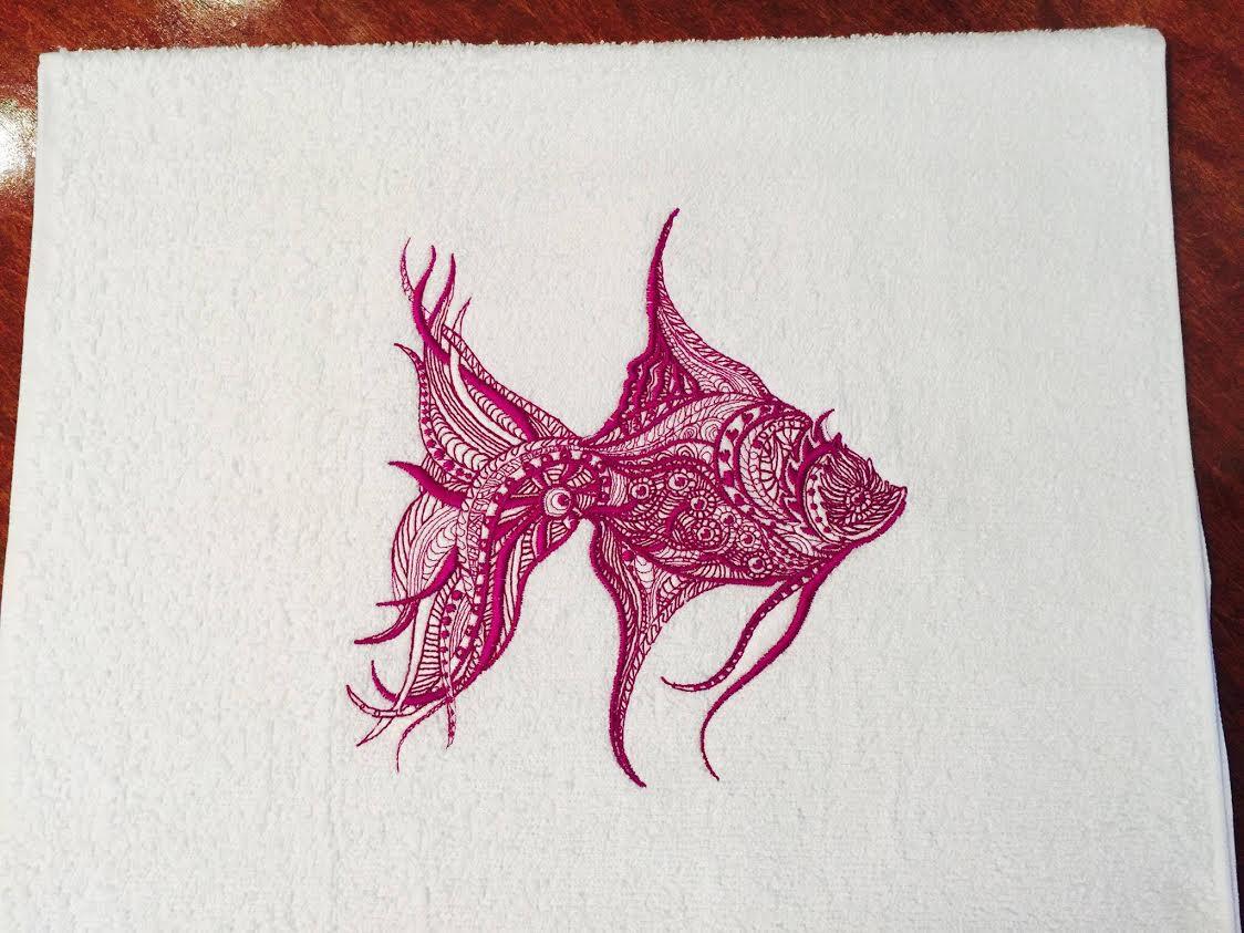 Embroidered towel with lace fish design